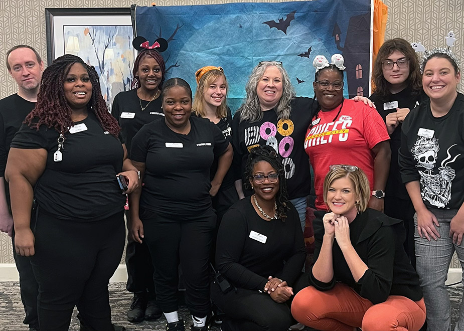 Group photo of Boulevard team members at a Halloween event.