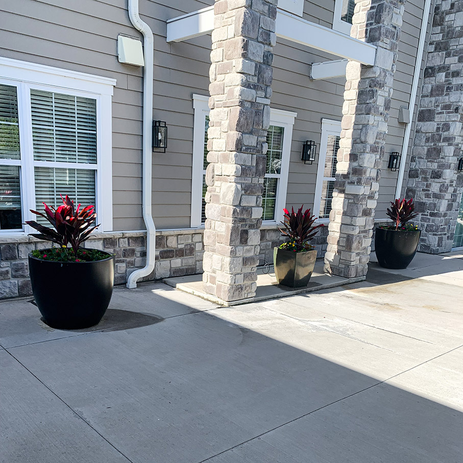 Three large planters decorate the exterior of the community.