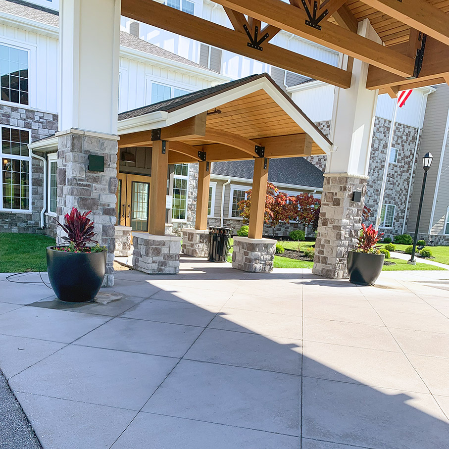 The exterior entrance of The Boulevard of St. Peters, adorned with newly installed planters.